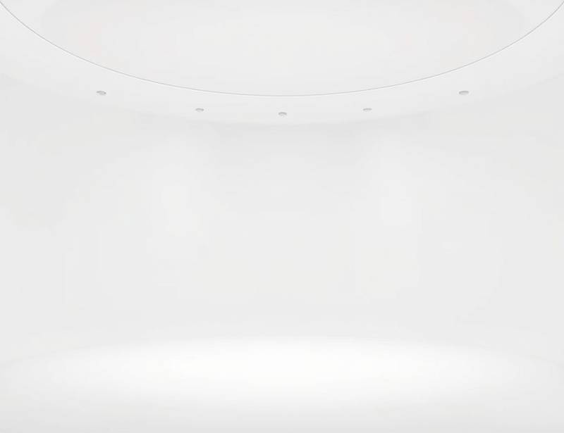 Cyclorama studio with a curved white wall, perfect for seamless backgrounds in photos and videos.